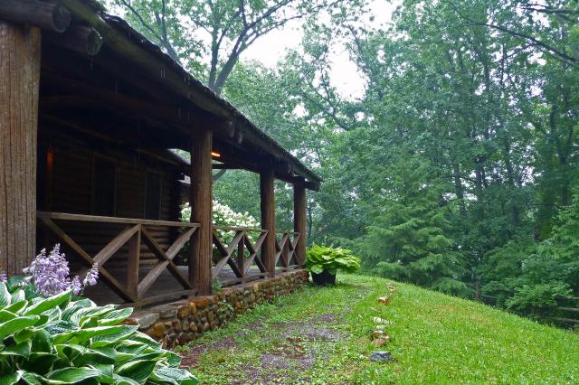 log cabin porch in rain