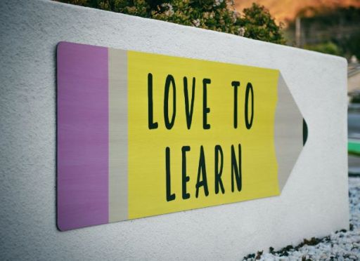 Love To Learn sign on concrete wall
